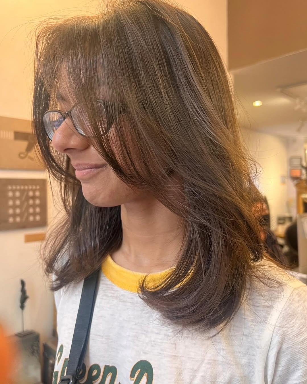 Long, straight, dark brown hair with smooth layers and a sleek, naturally shiny finish. 3