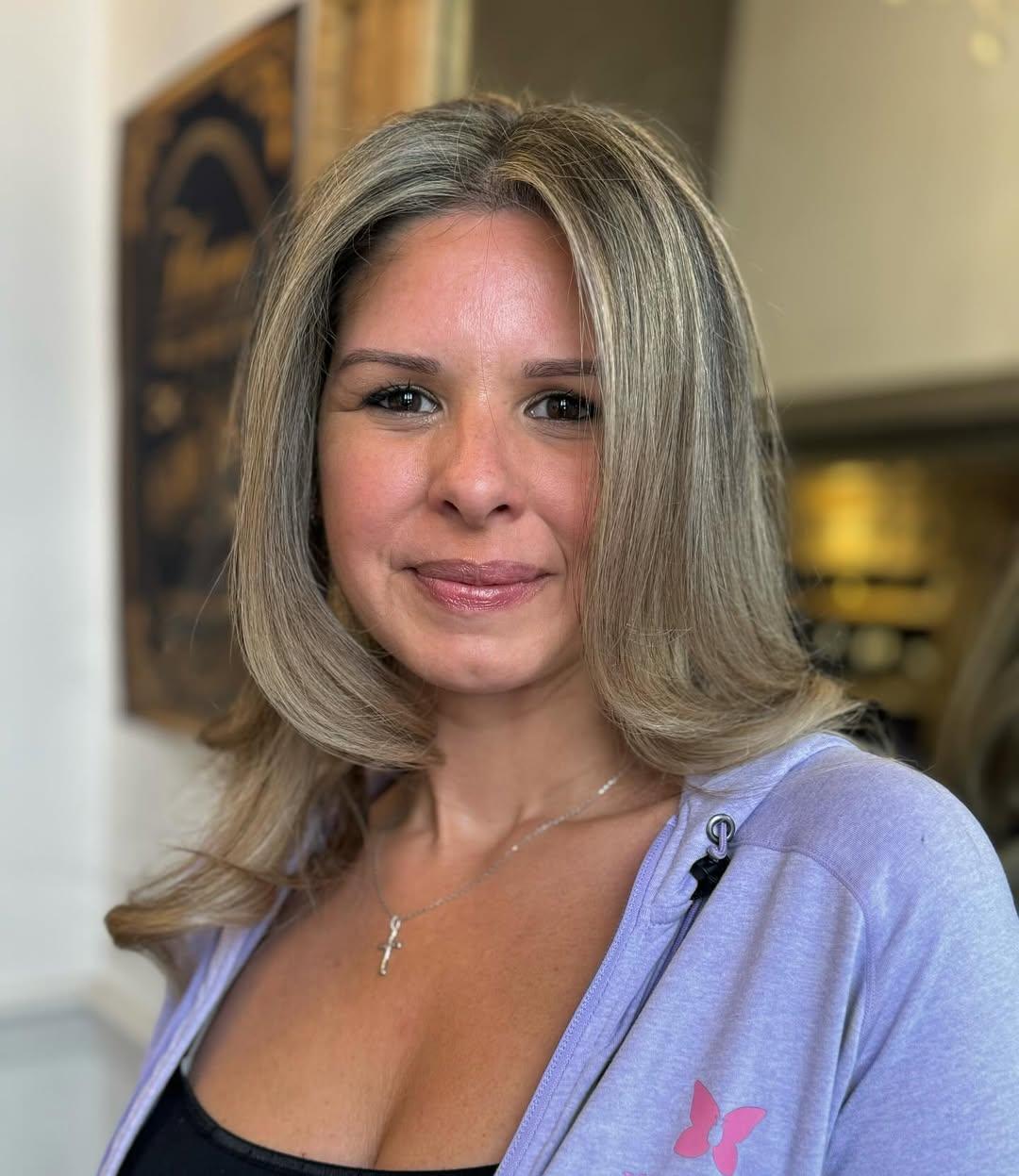Long, wavy blonde hair with natural highlights, featuring soft, loose waves and layered dimensions. 3