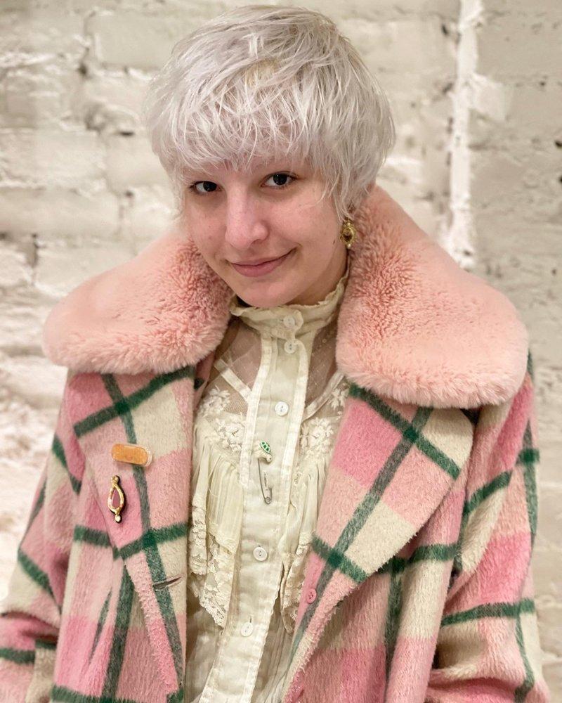 A short, textured pixie cut with edgy layers. by YO-C Salon