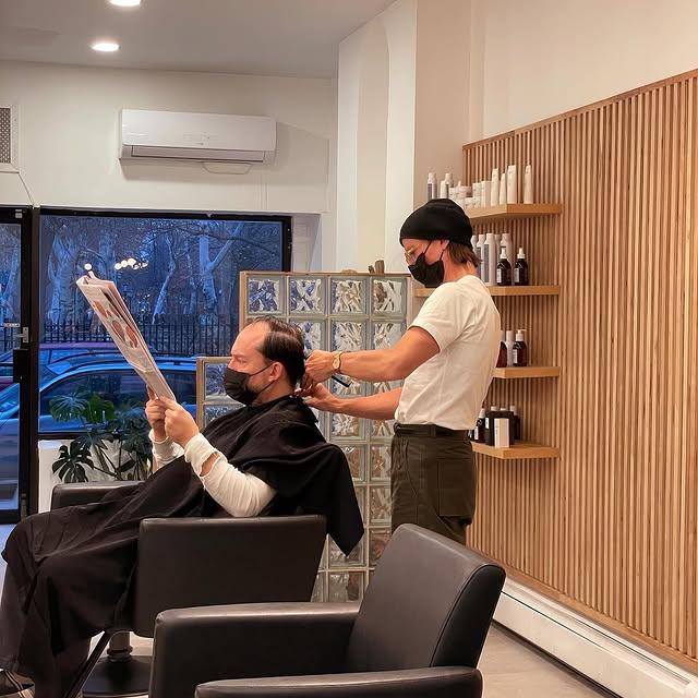 A classic short barbered haircut that is easy to style and maintain, offering a professional look.
