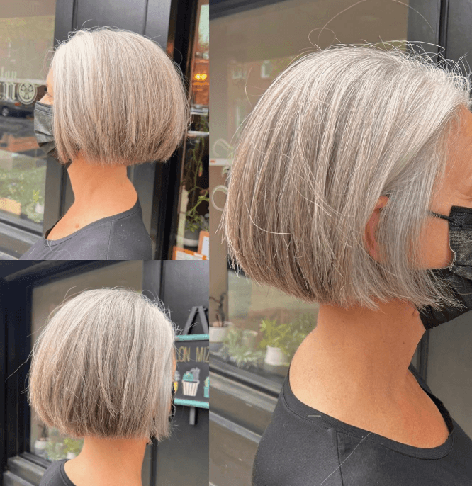 A sleek, chin-length silver bob with a smooth, straight finish.
