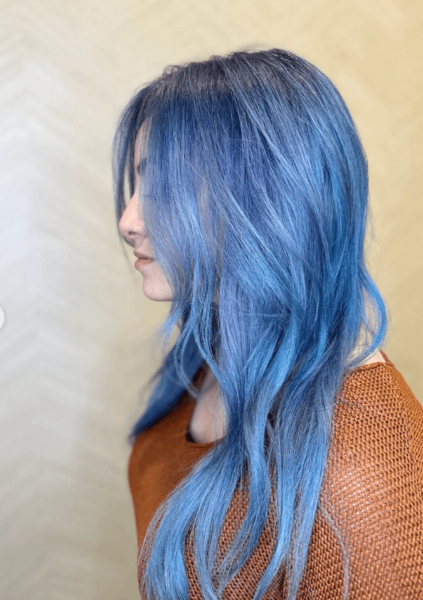 Long, wavy hair with a blue to lavender gradient, featuring soft, face-framing layers and gentle waves. 2