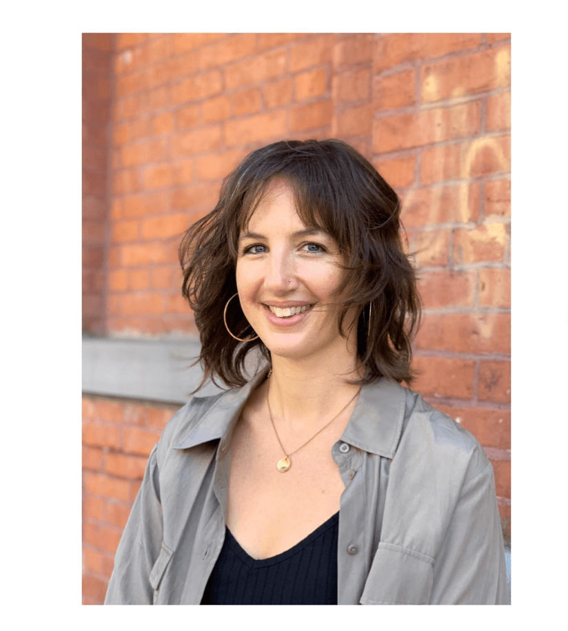 Trendy shaggy bob with textured layers and face-framing bangs for wavy hair.