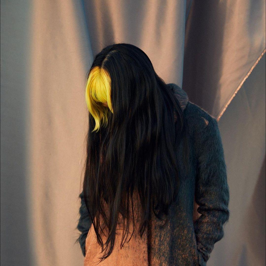 Edgy hairstyle with bright yellow blunt bangs and long black wavy locks, creating a bold contrast and a punk flair. by @takeohair  2