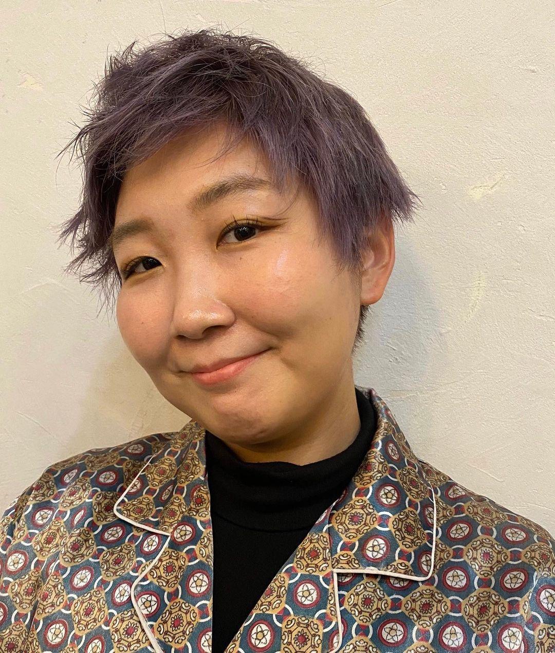 A playful and textured pixie cut with vibrant lavender color, featuring layers for added volume and a slightly tousled finish for an edgy look. (Hair by Coco) 2