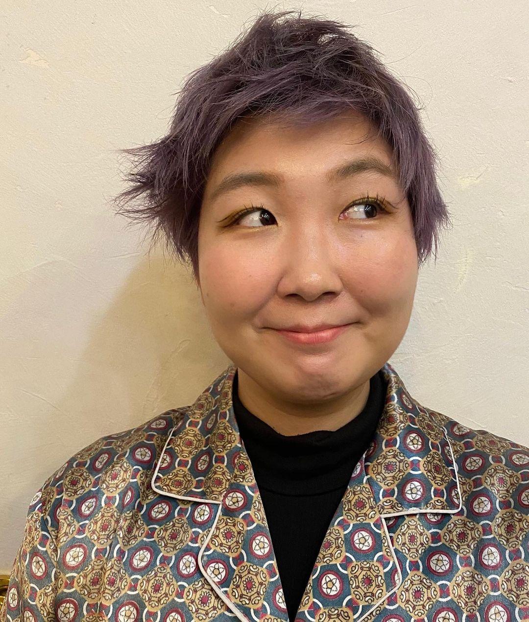 A playful and textured pixie cut with vibrant lavender color, featuring layers for added volume and a slightly tousled finish for an edgy look. (Hair by Coco) 3