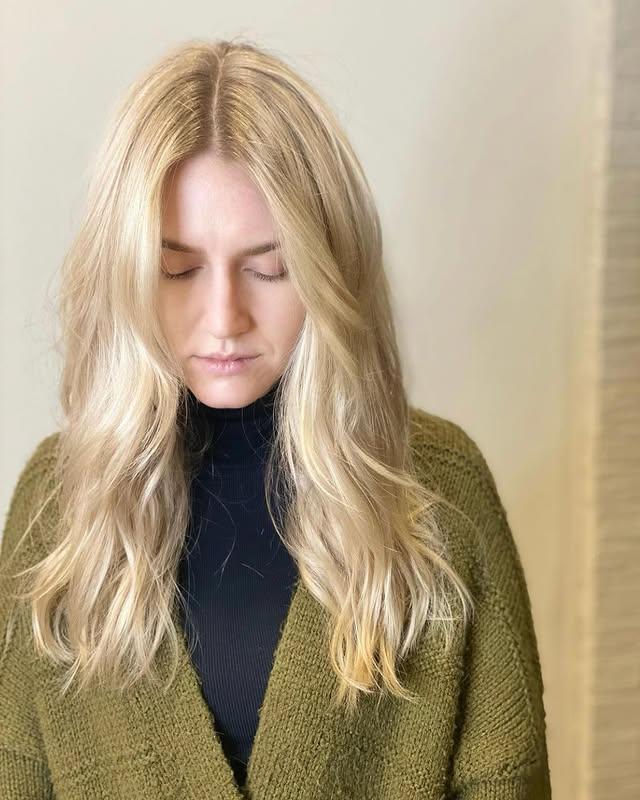 Long, wavy hairstyle with soft beachy waves and face-framing layers. by KeptStudio NYC