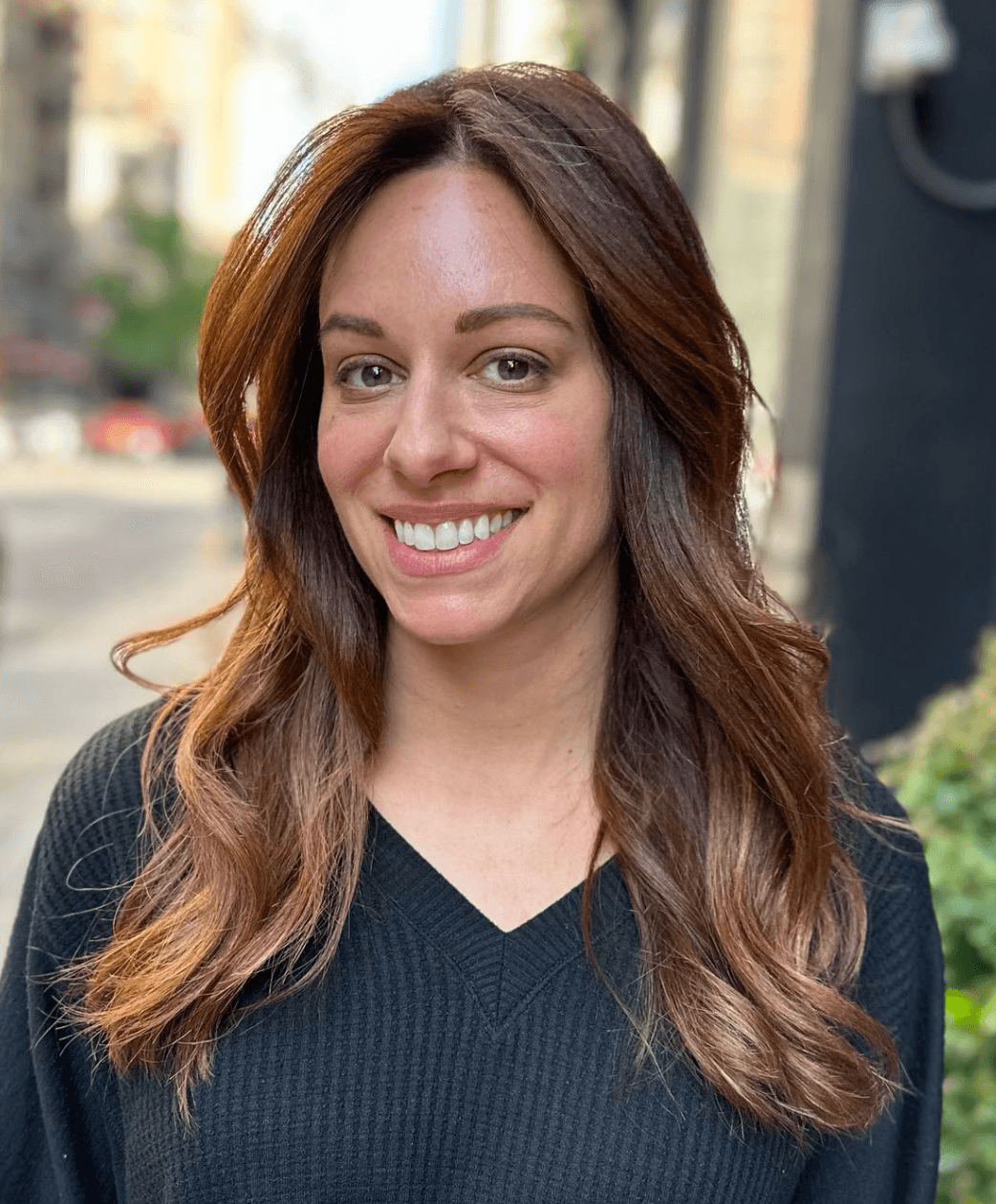 Long, light brown wavy hair with golden highlights, soft waves, face-framing layers, and a side part.

 3