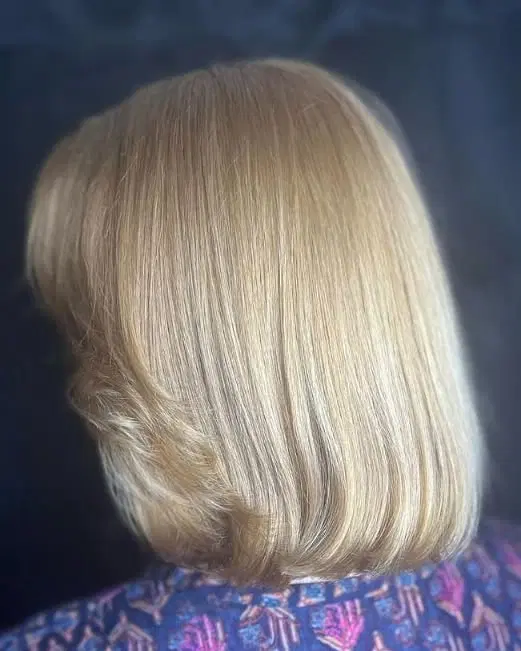 A classic bob with subtle layering and blonde hair, offering a timeless and fresh appearance.