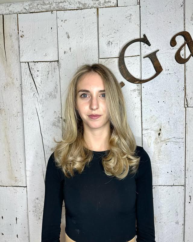 A medium-length wavy hairstyle featuring beachy waves. by T-Gardens NYC