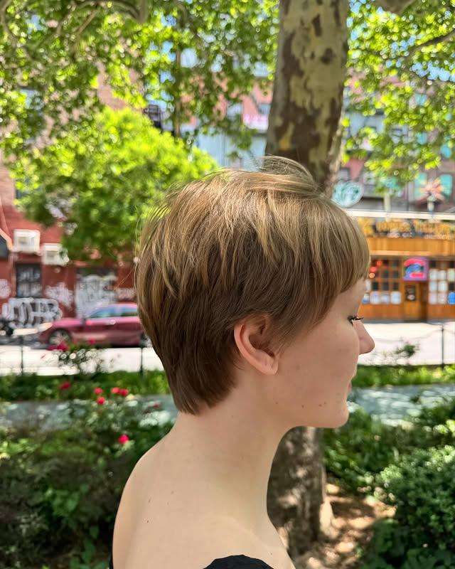 A short pixie cut featuring textured bangs and choppy layers for an edgy and modern style.