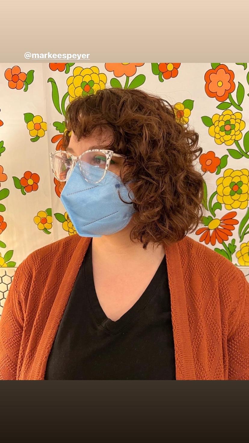 Voluminous curly bob with natural bangs, styled in Brooklyn, New York