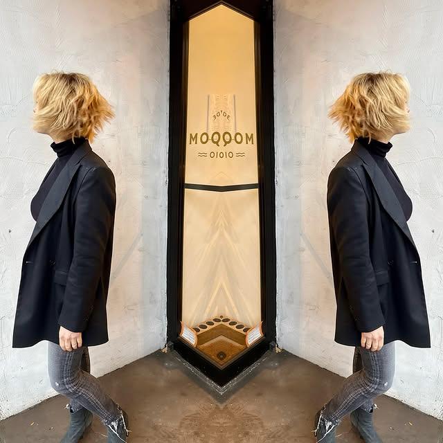 Short, wavy bob with textured layers that add volume and movement, perfect for fine hair.