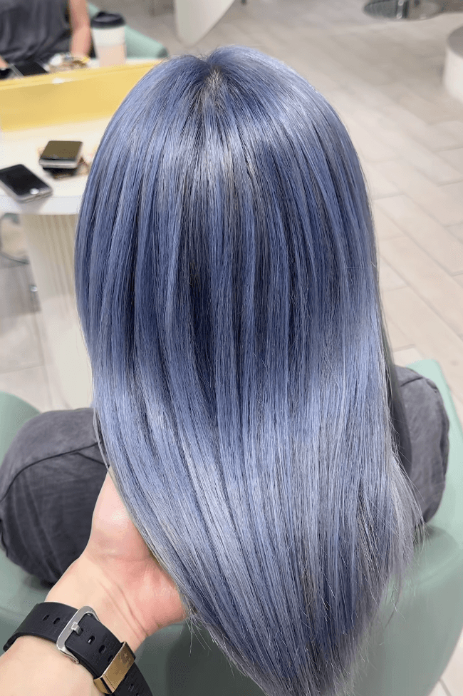Sleek medium-length straight blue-silver hair with a metallic sheen.