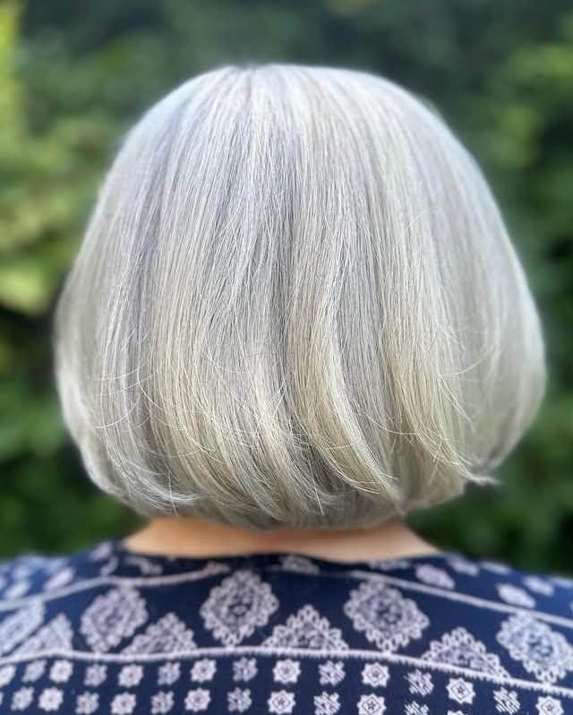 A timeless and elegant bob cut in a classic grey shade.