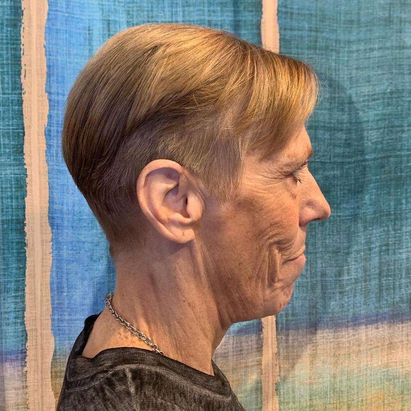A chic short, tapered pixie cut with blonde highlights, offering a fresh and modern look.