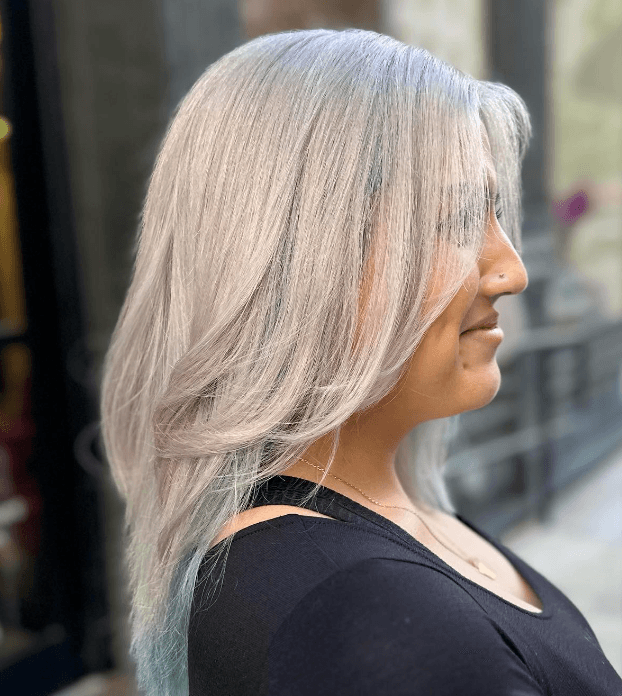 Medium-length, straight silver hair with soft waves and light blue ombre tips, featuring face-framing layers and a sleek finish.
 3