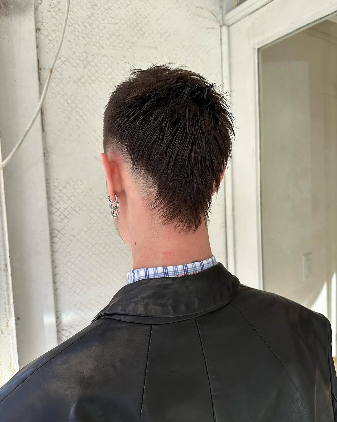 A burst fade with a textured top and sleek, tapered sides, creating a bold and contemporary look. 2
