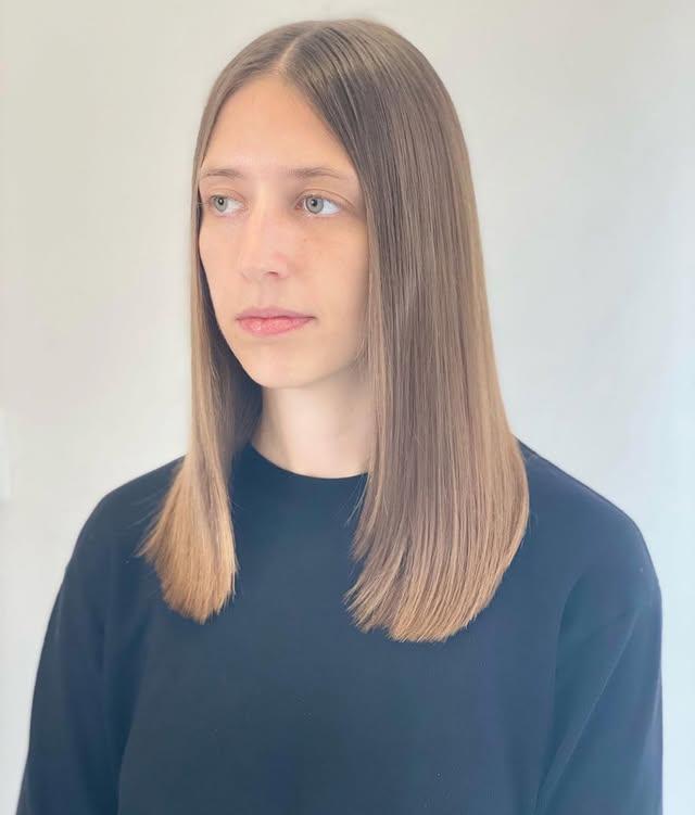Sleek, straight medium-length brunette balayage with subtle face-framing layers