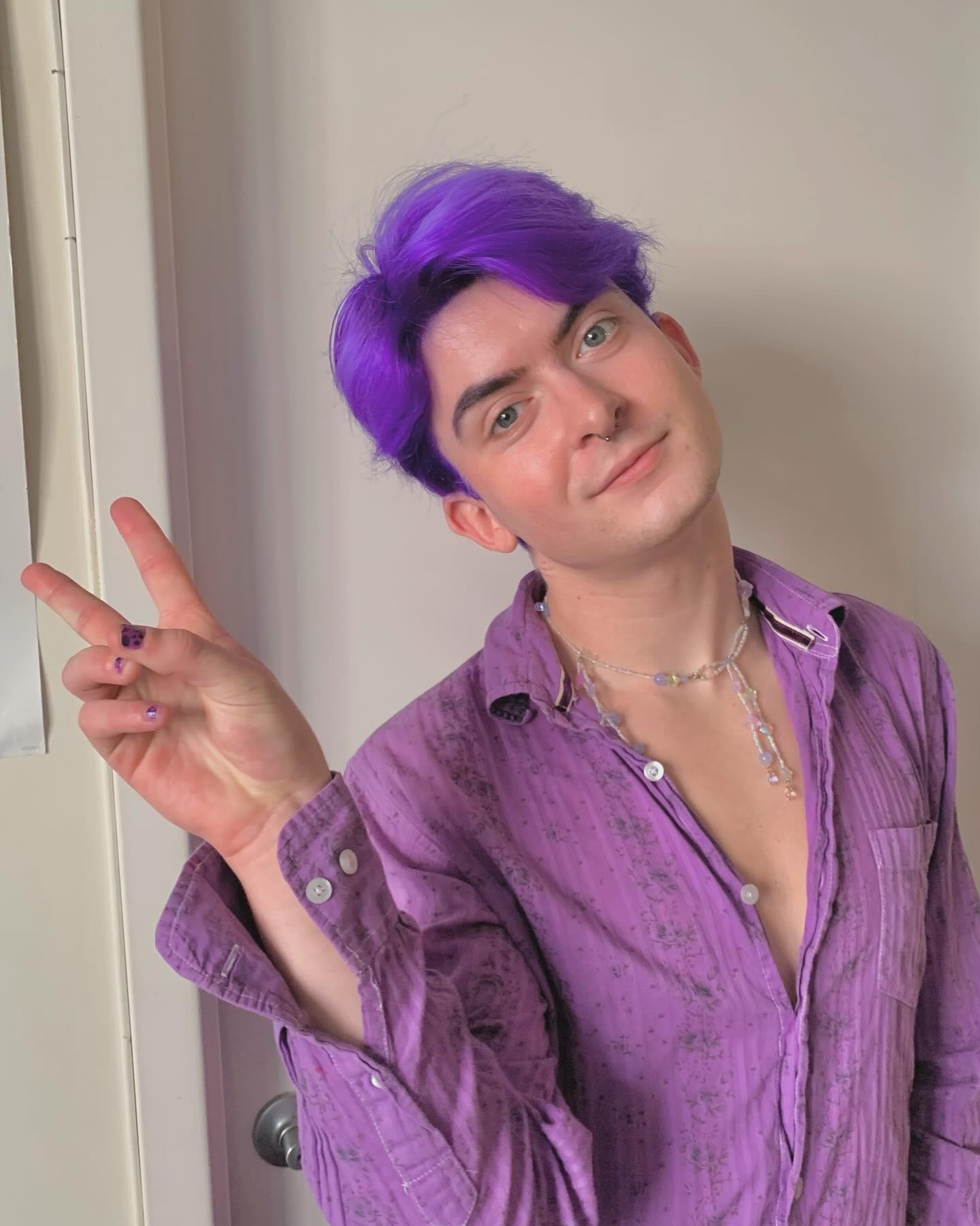 Vividly straight purple hair with a center part, short and playful, giving off an edgy and bold vibe, ideal for a trendy look. 2