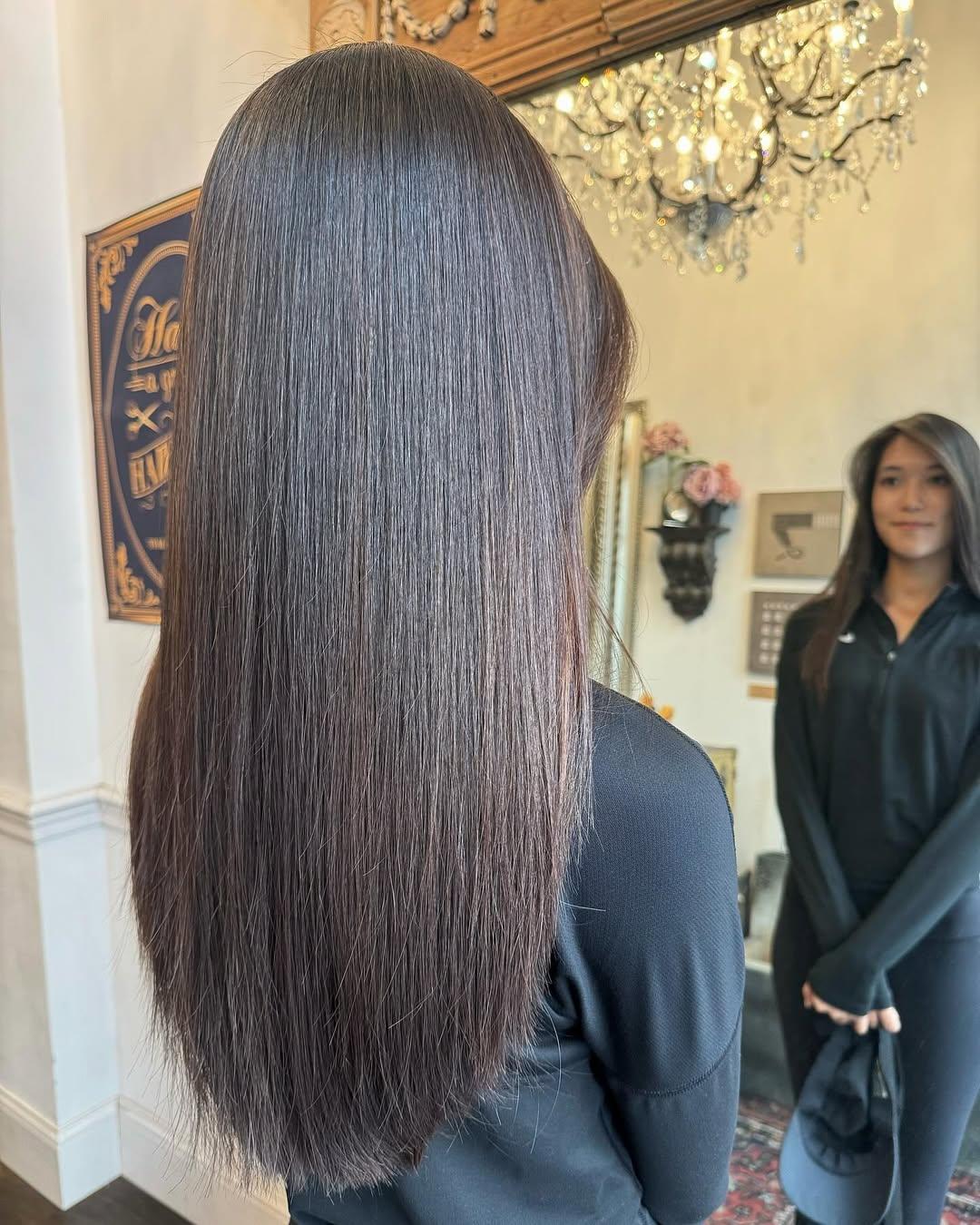Extremely straight, very long dark brown hair with ultra-smooth, silky texture and minimal layers, giving a sleek and elegant appearance. 1