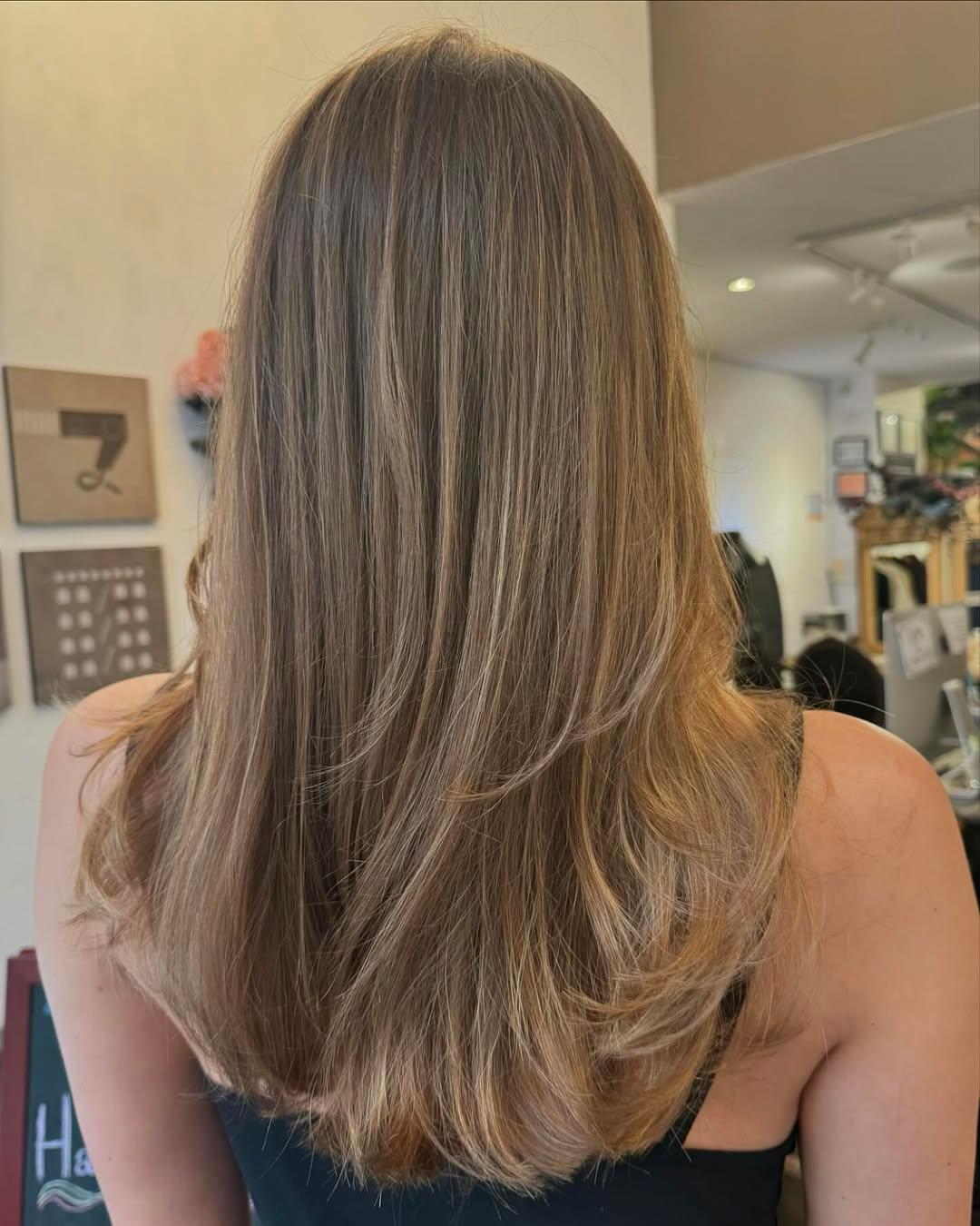 Long, straight hair with golden blonde and honey hues, featuring layered ends for a natural flow. 1