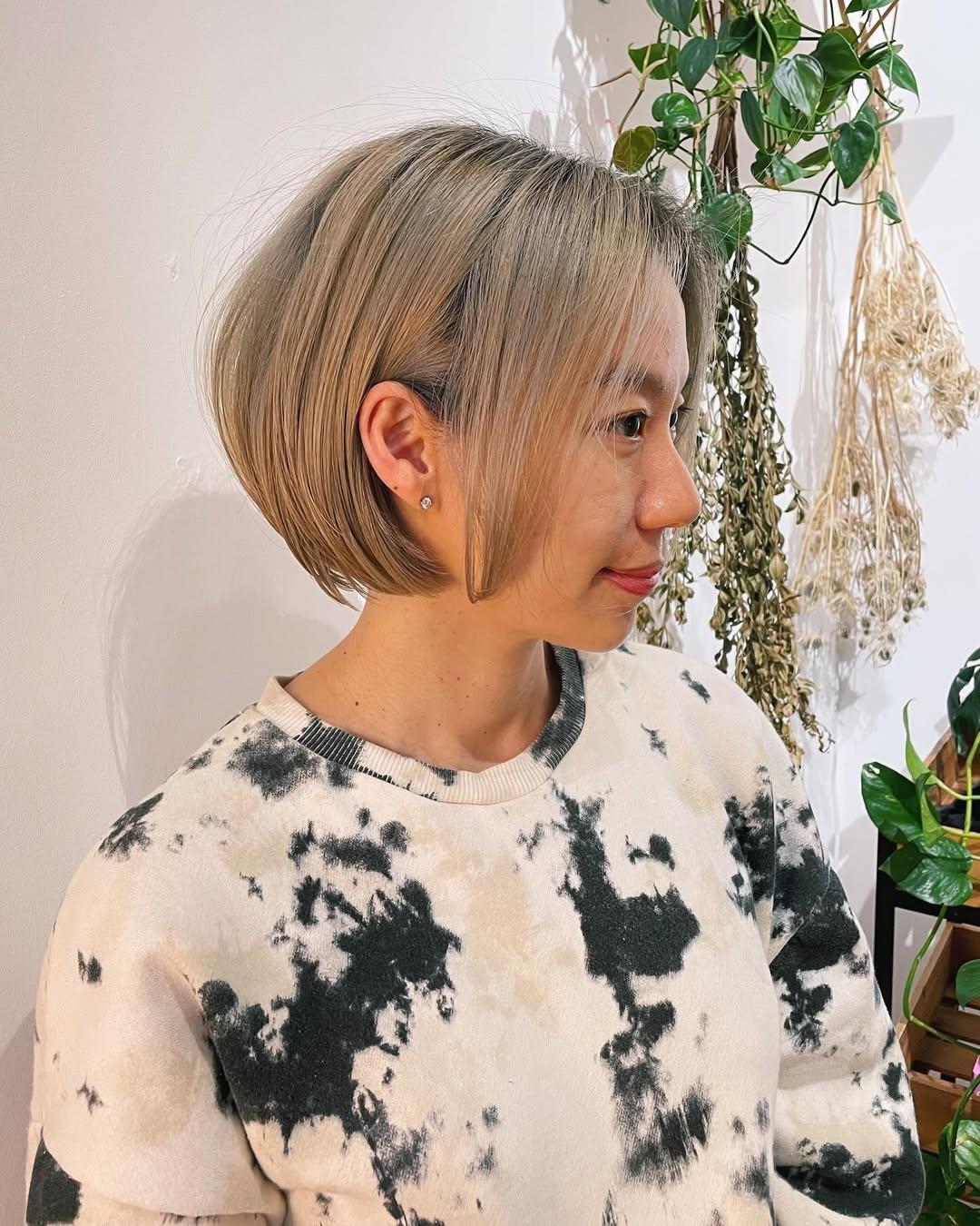 A chin-length blunt bob with subtle face-framing layers. 1