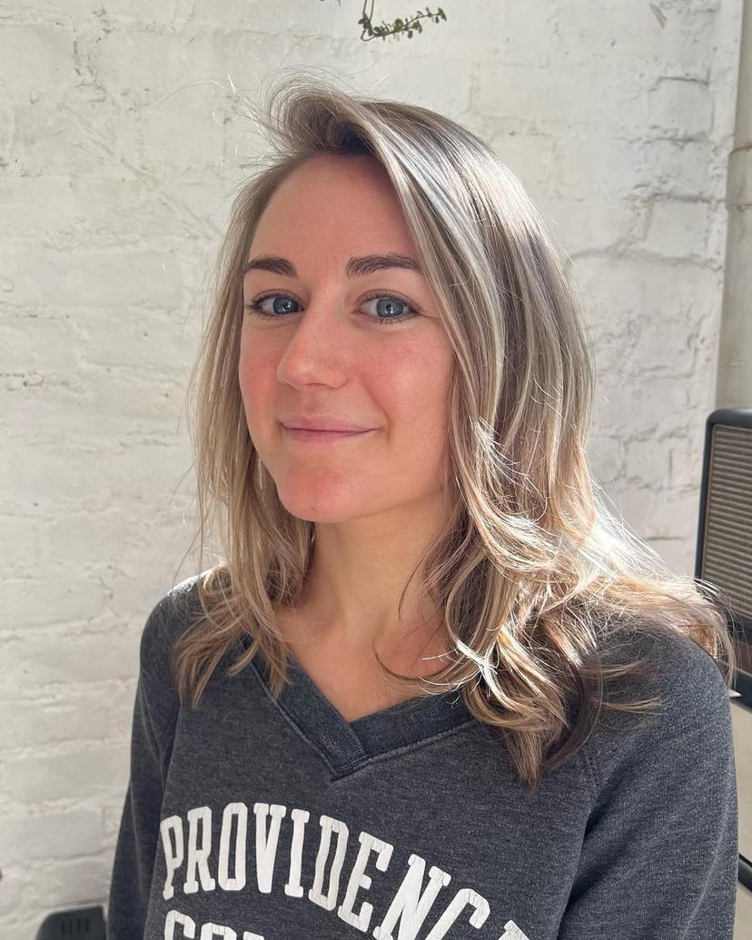 A medium-length long bob with beach waves in a blend of blonde and brown colors.