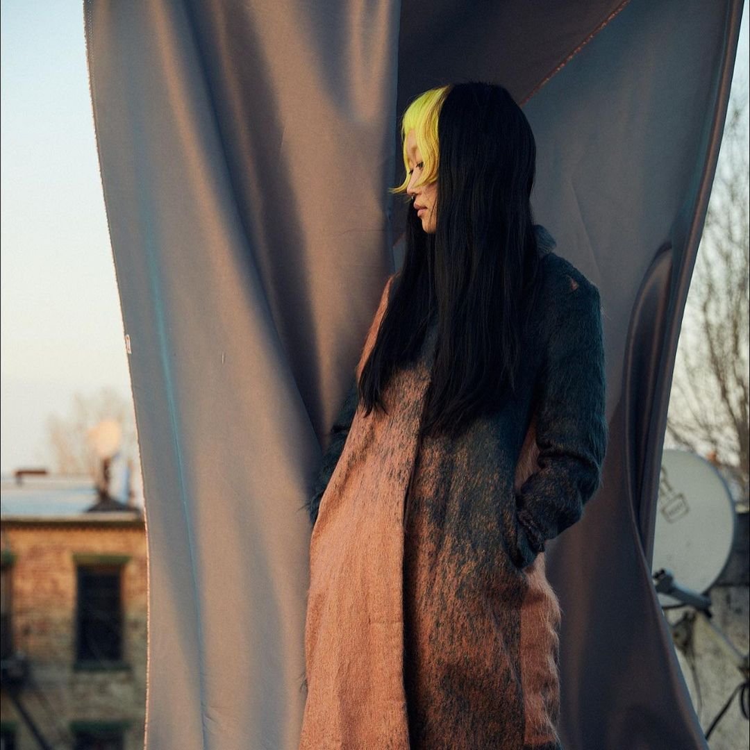 Edgy hairstyle with bright yellow blunt bangs and long black wavy locks, creating a bold contrast and a punk flair. by @takeohair  4