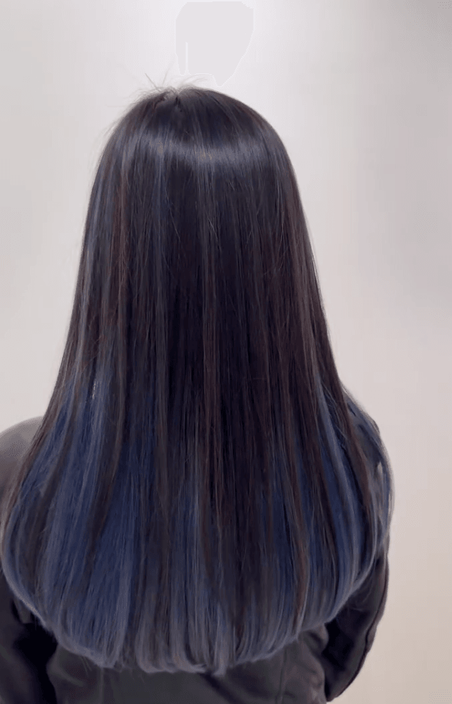 Long, straight hairstyle with an ombre transition from black to blue, featuring sleek and shiny layers. 3