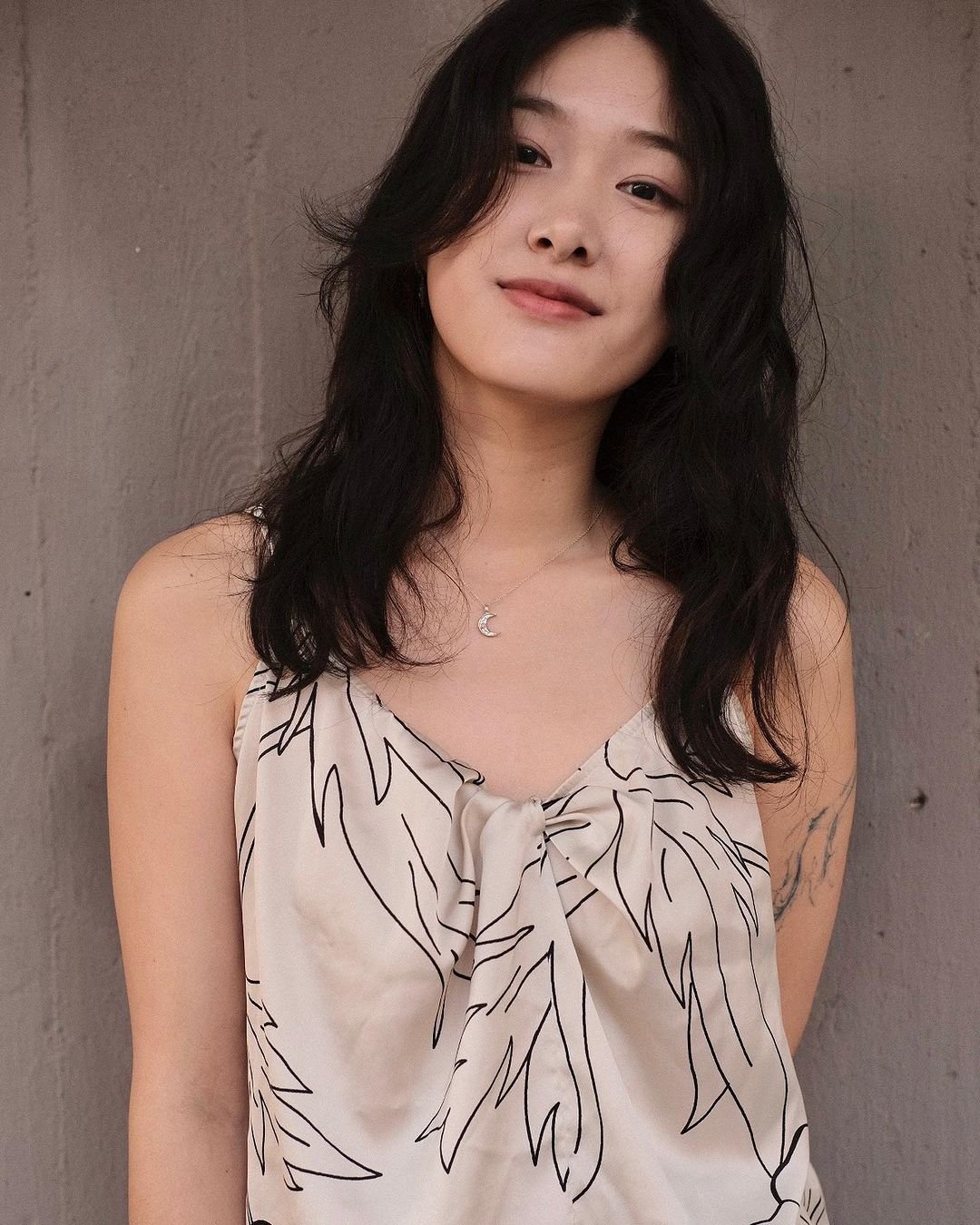 Long, wavy black hair with face-framing layers and a loose, natural texture. 3