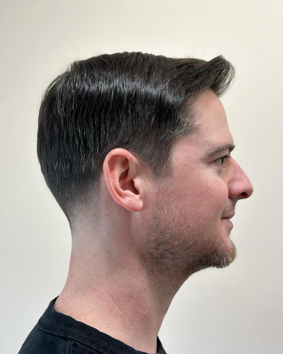 A sophisticated short haircut with a classic side part and tapered fade, ideal for a polished and professional look. 1